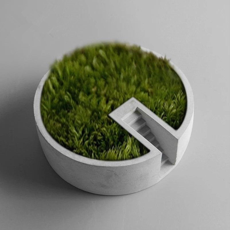 Circular Cement Plants Decor (No Plants) – Desktop Decor
Functional Elegance: More than just a visual treat, this moss decor is thoughtfully designed with a flat surface to hold your cherished collectibles, stationary, or