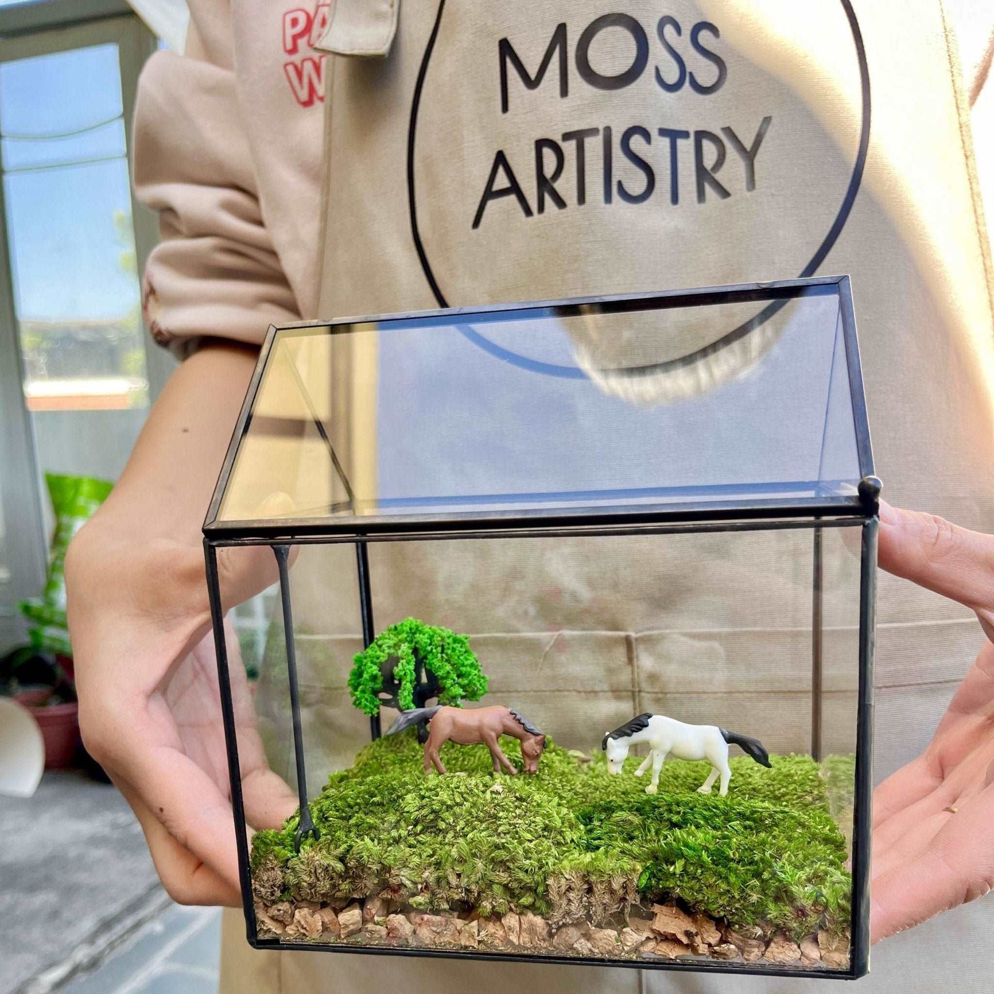 Tranquil Pasture Handmade Glass Terrarium - Miniature Equestrian LandsIntroduce a serene and picturesque scene to your workspace with our "Tranquil Pasture" Handmade Glass Terrarium - a Miniature Equestrian Landscape. This enchanting w